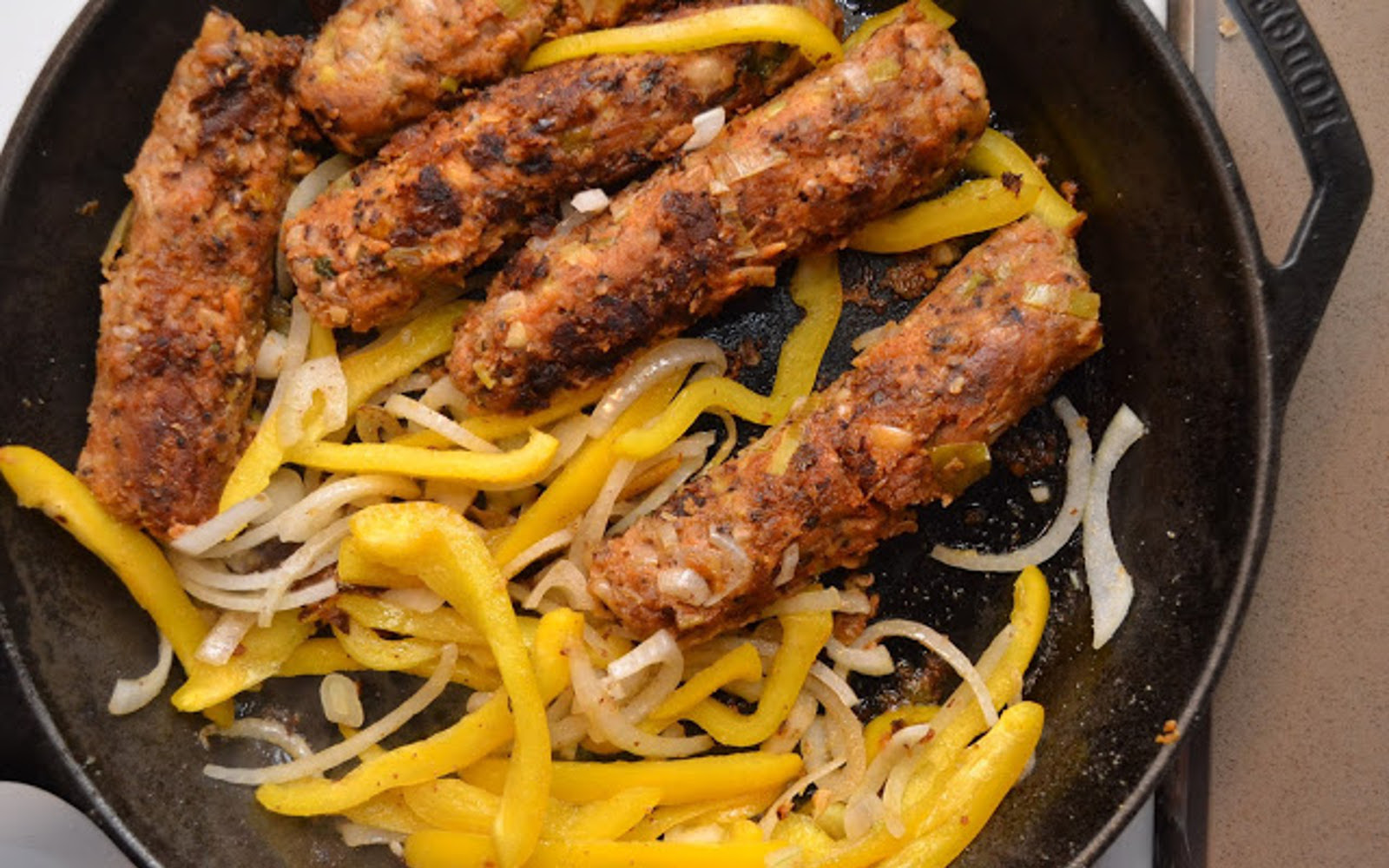 Vegan Black-Eyed Pea and Leek Sausages with peppers